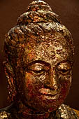 Ayutthaya, Thailand. Viharn Phra Mongkhon Bophit, Buddha heads covered in gold leaves. 